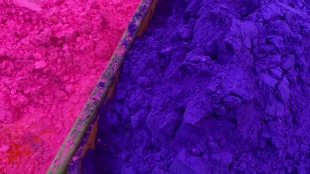 Close up shot of pink and blue colored Gulal or Holi powder sold in local shop in India.
