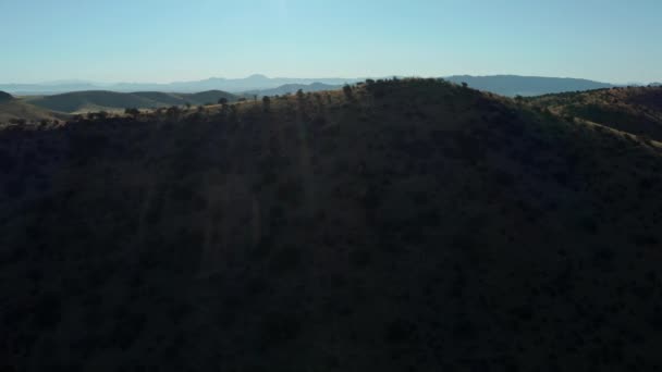 Aerial Coming Ridge Revealing Remote Road Desert Landscape — Stock Video