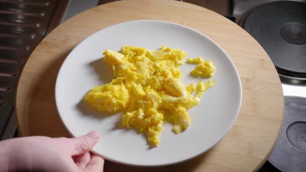 Person Serving Plate Scrambled Eggs Removing Plate — стоковое видео