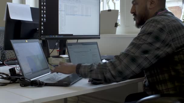 Ethnic Minority Man Wearing Shirt Working Few Computers Simultaneously Waist — Vídeo de Stock