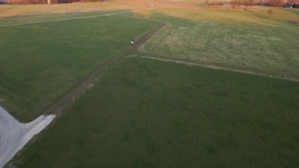 Person Sitting His White Scooter Lush Field Sunset Wide Angle — Vídeo de Stock