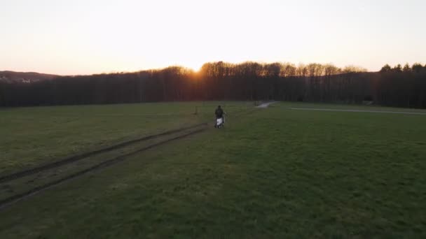 Young Man Sitting Scooter Lush Green Field Magnificent Sunset Germany — Wideo stockowe