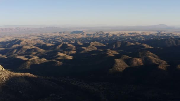 Sunset Aerial Rolling Arid Desert Hills Covered Shadows — Stok video