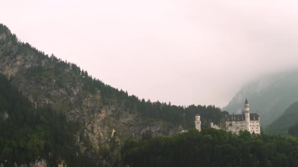 Aerial Dolly Dramatic Neuschwanstein Castle Hillside Surrounded Dense Green Pine — 비디오