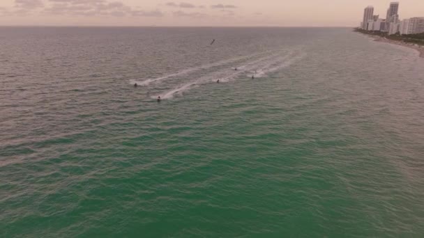 Aerial Dolly Lowering Group Skilled People Jet Skiing Turquoise Sea — Stock video