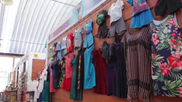 Cheap Colourful Clothes Women Kids Hanging Local Shop Sale Market — стоковое видео