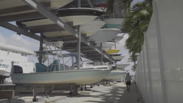 Man Inspects Number Different Boats Large Storage Area — Video Stock