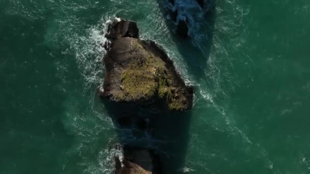 Slea Head, Kerry, Ireland, March 2022.  Drone in Birds-eye view pushes east towards Dunquin Pier on the Dingle Peninsula off the North Atlantic Ocean.