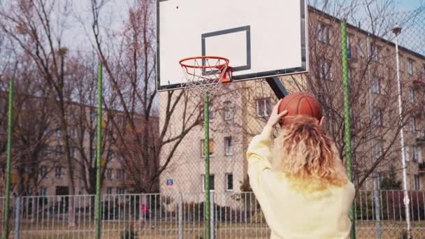 Young Girl Shoots Basketball Outdoor Court Celebrates Slowmo — Video