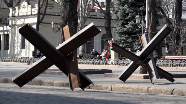 Two Women Walk Women Sitting Bench Tank Traps Made Welded — Vídeo de stock