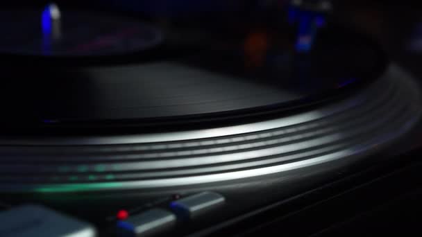 Vinyl Record Spinning on Gramophone, Night Club Disco Lights and Vintage Music, Close Up