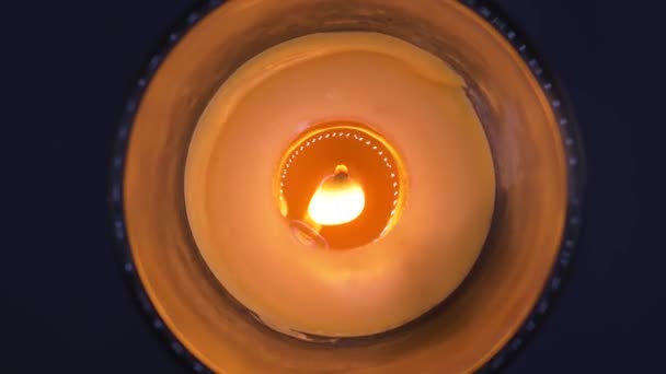 Overhead Shot Burning Scented Candle Rotating Black Background — Stock Video