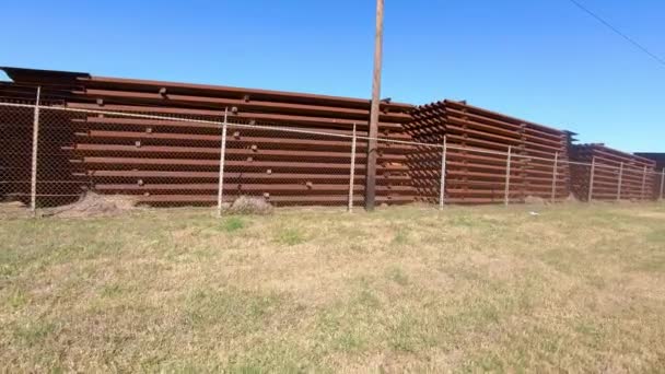 Pov Driving Metal Panels Stockpiled Building Border Wall Texas Usa — Vídeo de stock