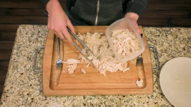 Caucasian Male Putting Skinless Shredded Chicken Breast Plastic Food Containers — Vídeos de Stock