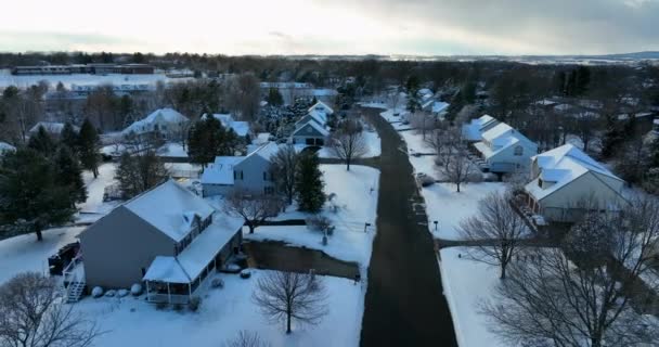 American Homes Winter Snow Suburban Community Aerial Pullback Reveal Reverse — Video