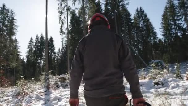 Forest Worker Walking Snowy Woods Chainsaw Hand Handheld View — Video