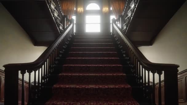 Old Grand Staircase 1900 Mansion Sun Peaking Windows — Stock Video