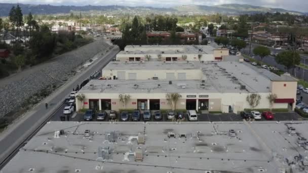 Aerial Drone Flies Office Building Complex Cars Parked — Video