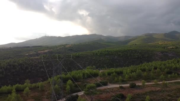 Drone Shot Moving Backwards Hilly Arid Landscape Covered Couds Electrical — Wideo stockowe