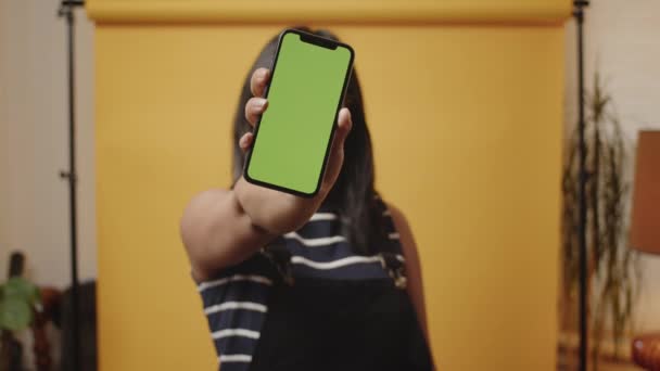 Smiling Young Asian Woman Holds Smartphone Greenscreen Out Camera Home — 비디오