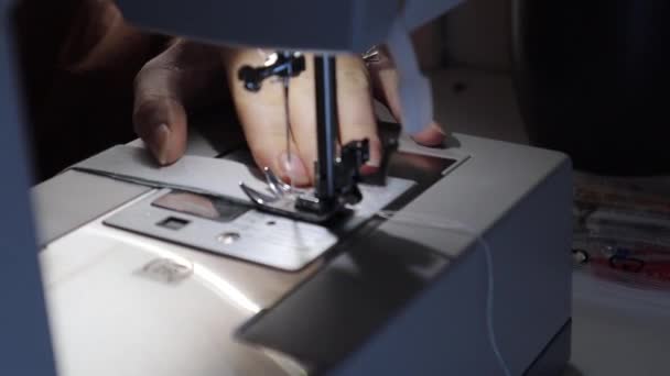Closeup Young Woman Hands Carefully Stitching Light Blue Fabric Cloth — Vídeo de stock
