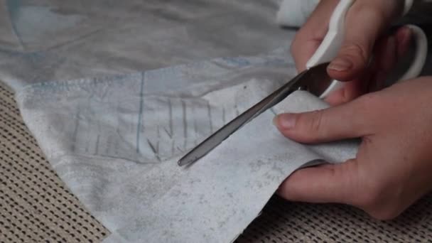 Closeup Young Woman Hands Carefully Cutting Light Blue Fabric Cloth — Stockvideo