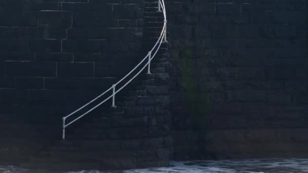 Waves Crash Steps Dark Coloured Stone Brick Sea Wall White — стоковое видео