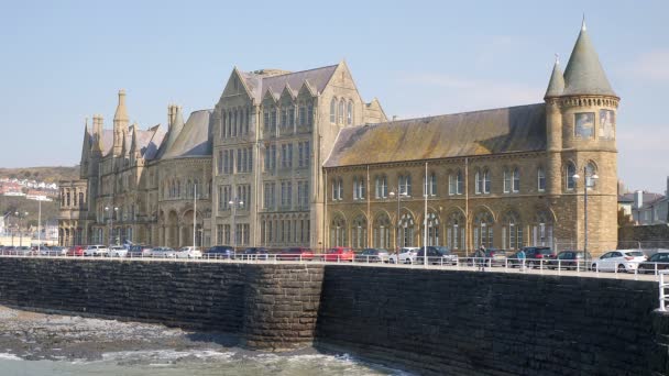 Sea Laps Front Old College Building Sea Front Aberystwyth Promenade — стоковое видео