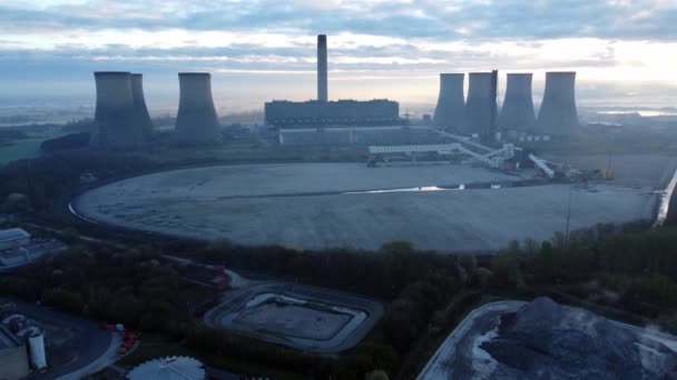 Power station cooling tower horizon on sunrise foggy countryside scenic England morning aerial view