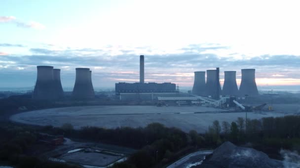 Power station cooling tower horizon on sunrise foggy countryside rural England morning aerial view Britain