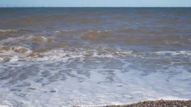 Windy Waves Crashing Pebble Beach Shore Spraying Sea Foam — Stock Video