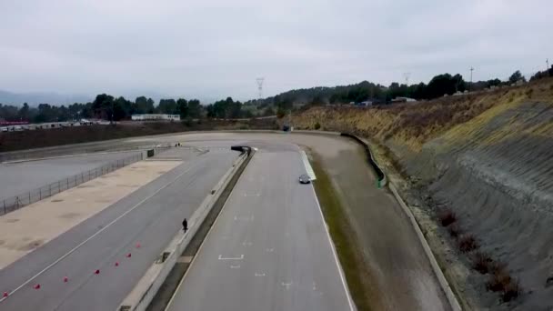 Aerial Shot Sports Cars Entering Main Straight Racing Circuit — Stock Video