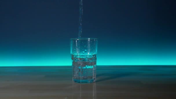 Glass Filled Water Spills Table — Stockvideo