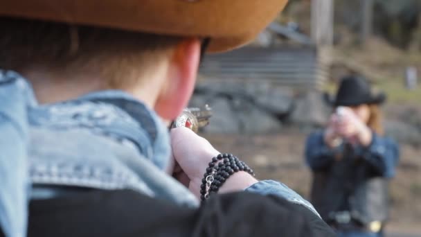 Cowboy Cowgirl Duel Pointing Guns Each Other — Stockvideo