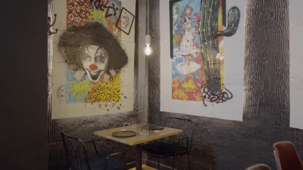 Slow Pan Colorful Clown Artwork Wall Empty Restaurant Table — Wideo stockowe