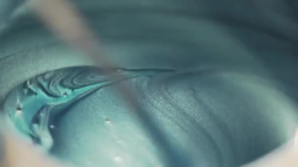 Close Metallic Blue Paint Being Stirred Together — Stockvideo