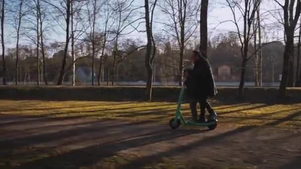 Grandfather Enjoys Riding Electric Scooter His Grandson Morning Atmosphere City — Vídeo de stock