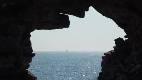 Rocks Framing View Open Sea Sailing Boat Seen Horizon — Stock Video