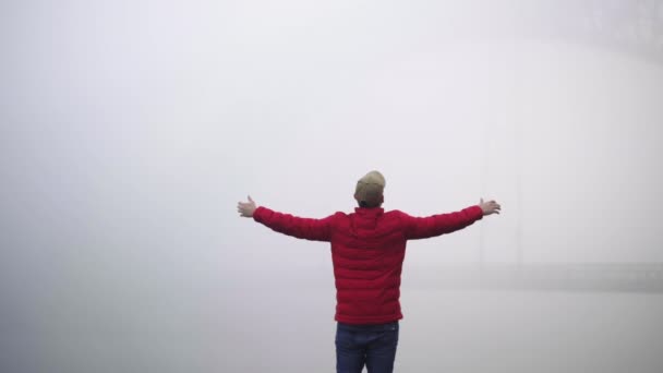 Male Wearing Red Jacket Celebrating Life Misty Magical Foggy Atmosphere — стокове відео