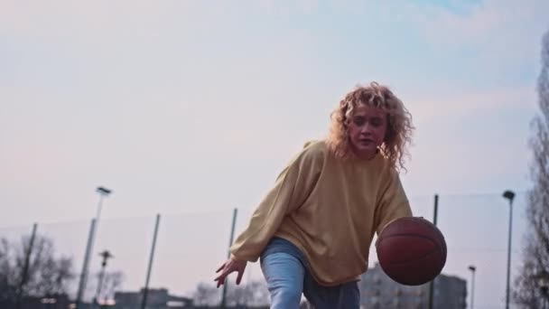 Teenage Caucasian Girl Casual Street Clothes Dribbling Basketball Slow Motion — Vídeos de Stock