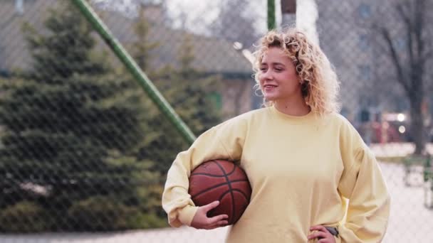 Confident Teenage Caucasian Girl Power Posing Basketball Arm Girl Power — Vídeos de Stock