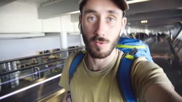 Young Backpacker Vlogging Modern Smartphone While Waling Moving Walkway International — Wideo stockowe