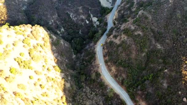 Aerial Drone View Tracking Sports Car Distant Mountain Road Sunset — Vídeo de stock