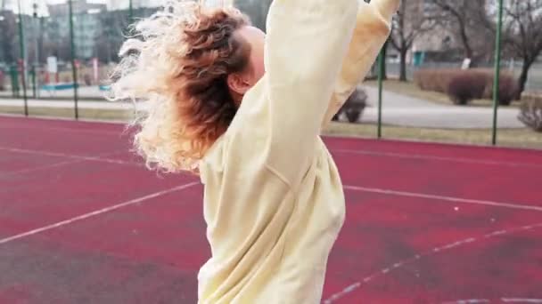 Young Girl Shoots Basketball Outdoor Court Laughs Raises Arms — Stockvideo