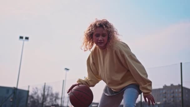 Slow Motion Teenage White Girl Casual Street Wear Dribbling Basketball — Stockvideo