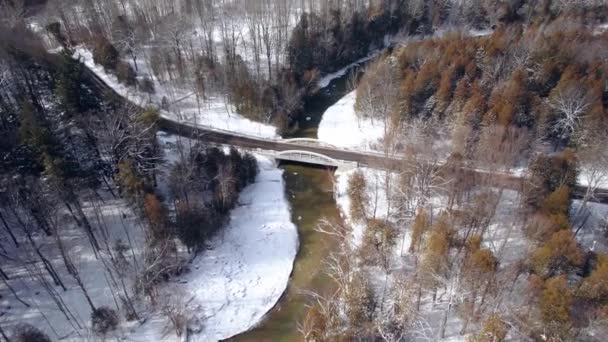 Scenic Bridge Winding Road Spanning Wide River Set Winter Landscape — стокове відео