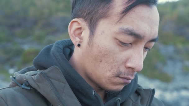 Young Nepali Man Focused Recording Video Outdoors — Vídeo de stock