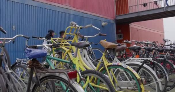 Amsterdam Row Bikes Locked Front Business Slow Motion Red Camera — Stockvideo