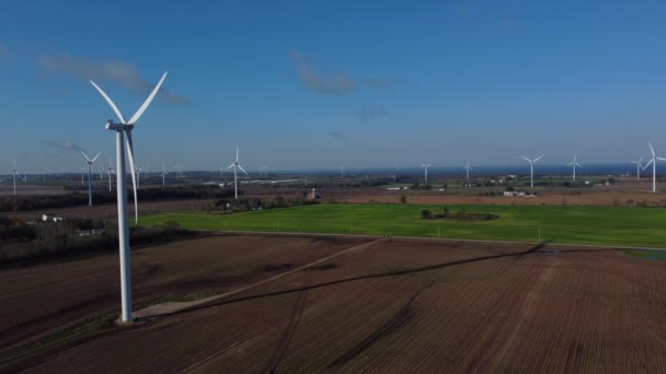 Wind Turbines Field Foreground Turbine Casting Long Shadow Aerial Drone — Vídeo de Stock