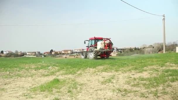 Farming Red Tractor Spraying Field Sprayer Herbicides Pesticides Modern Farm — Stock Video